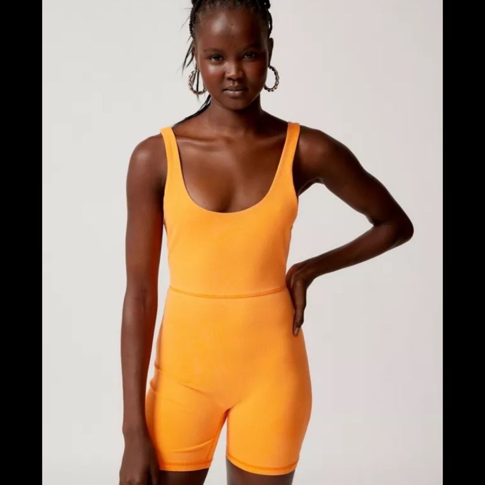 Urban Outfitters out from under large fluorescent neon Orange dive in singlet